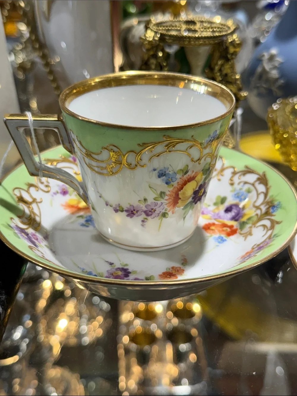 Elegant Green Floral Porcelain Teacup and Saucer with Gold Trim